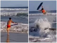 समुद्र में अचानक उठी ऊंची लहर, शख्स ने सर्फिंग कर लगाई बैक फ्लिप