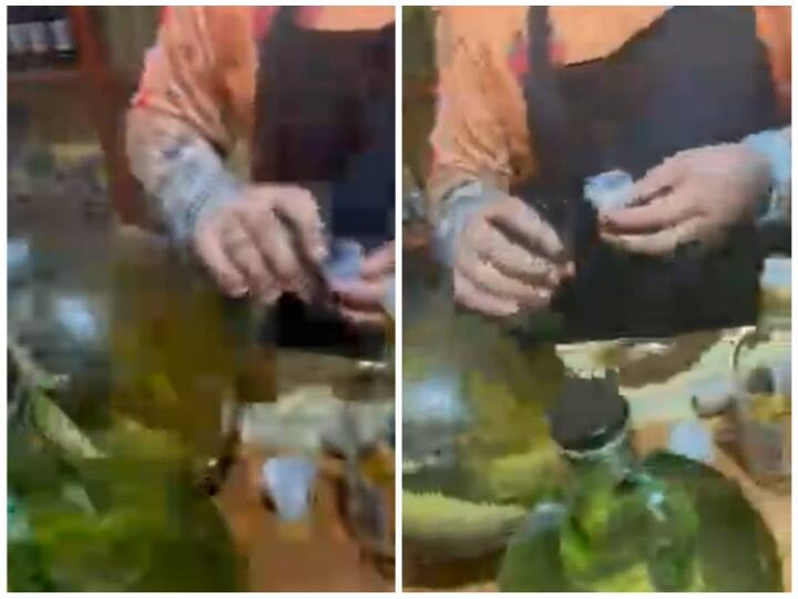 People were seen drinking wine kept with snake in a glass bottle Video: बोतल में सांप के साथ रखी शराब पीते दिखे लोग, अजब-गजब है ये दुनिया
