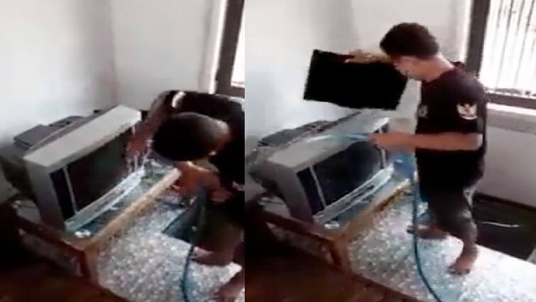 man seen washing tv computer screen with water funny video goes viral VIDEO: ਦੀਵਾਲੀ 'ਤੇ ਸਫਾਈ ਦਾ ਅਜਿਹਾ ਹੋਇਆ 'ਭੂਤ' ਸਵਾਰ, ਕੱਪੜੇ ਨਾਲ ਪੂੰਝਣ ਦੀ ਬਜਾਏ ਪਾਣੀ ਨਾਲ ਧੋਤਾ ਘਰੇਲੂ ਸਾਮਾਨ