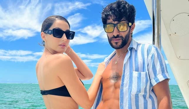 nora fatehi flirting with mystery boy in goa beach, latest pictures viral Love Life: ગોવાના બીચ પર મિસ્ટ્રી બૉય સાથે મસ્તી કરતી દેખાઇ નોરા ફતેહી, ડાન્સરે ખુદ શેર કરી તસવીરો........