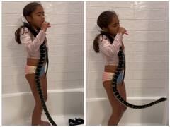 सांप को गले में डाल ब्रश करती नजर आई छोटी बच्ची, दिल दहला देगा वीडियो