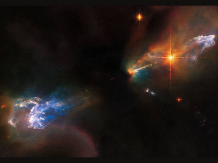 This is an image of the Herbig-Haro objects HH1 and HH2 captured by the NASA/ESA Hubble Space Telescope. Herbig-Haro objects are radiant regions surrounding newborn stars. These objects are formed when stellar winds or jets of gas ejected by newborn stars create shockwaves which, in turn, collide with nearby gas and dust at high speeds. Both HH1 and HH2 are present in the constellation Orion. (Photo: ESA/Hubble and NASA)