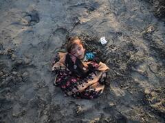 Children Buried Neck-Deep During Solar Eclipse 2022 In Pakistan. In Pics