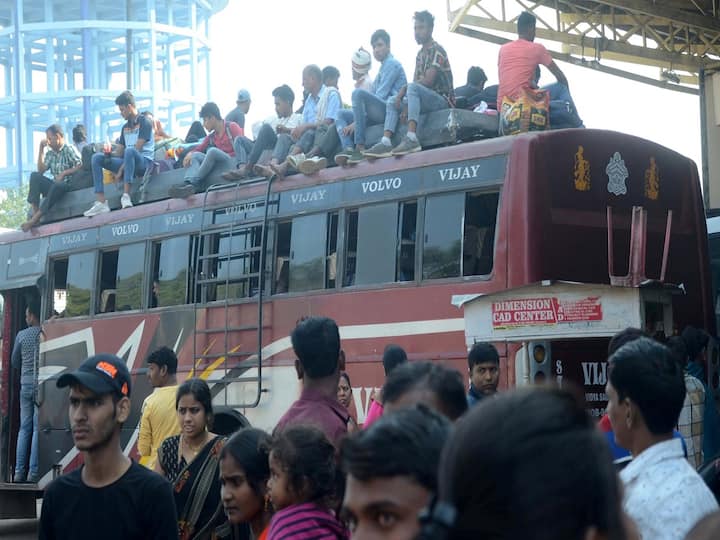 Hindu devotees from Bihar, Jharkhand, and Uttar Pradesh every year return home to celebrate 'Chhath Puja' festival. Here passengers are seen boarding a crowded bus at Birsa Munda Bus terminal in Ranchi, Thursday, Oct. 27, 2022. (PTI Photo)