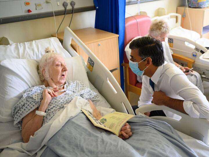 Sunak interacted with a senior patient recovering from surgery and asked how the hospital's nurses were looking after her. The patient told the UK PM, 'You need to pay them'. (Source: Getty)