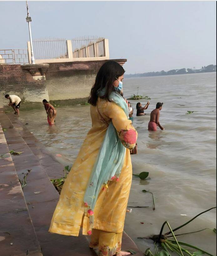 Anushka shared a picture of herself praying at a ghat in Kolkata