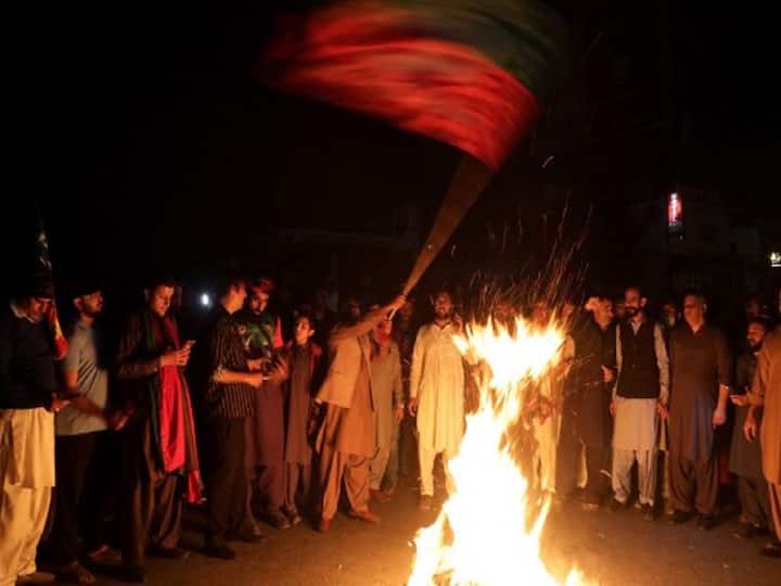 Supporters of Pakistan's former prime minister Imran Khan, take part in a protest against the assassination attempt on Khan, in Rawalpindi on November 3, 2022. Khan was in stable condition after being shot in the leg at a political rally on November 3 in what the country's president deemed 
