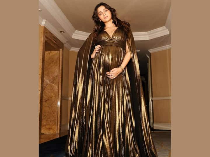 During her pregnancy, the new mother had demonstrated that being pregnant need not entail giving up your regular sense of style or sartorial preferences. To attend the TIME Impact Awards, Alia Bhatt had slid into a glittering bronze-gold gown by Gauri and Nainika. In a stunning floor-length gown with a plunging neckline, a cape-style train on the back, and a figure-skimming silhouette emphasising her baby belly, the expecting star had transformed into a Greek goddess. (Image Source: Instagram)