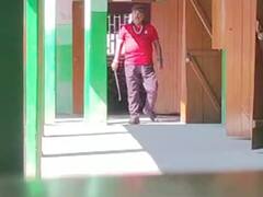 असम के एक स्कूल से शिक्षक को किया निलंबित, कैंपस में गंडासा लेकर घूमने का वीडियो वायरल