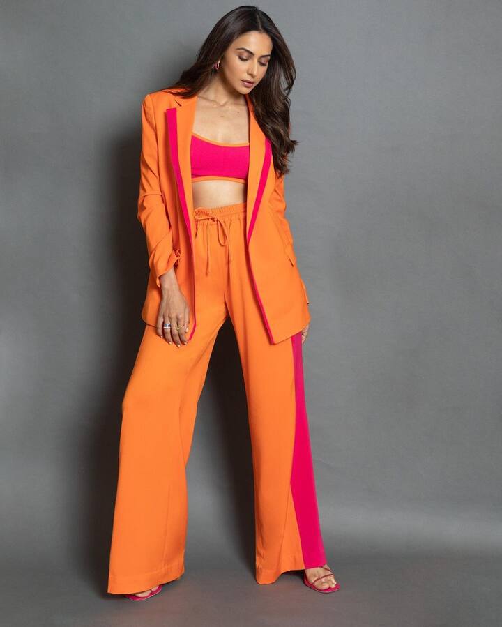 Rakul finished off her ensemble with orange hoop earrings and a pair of orange strappy heels.