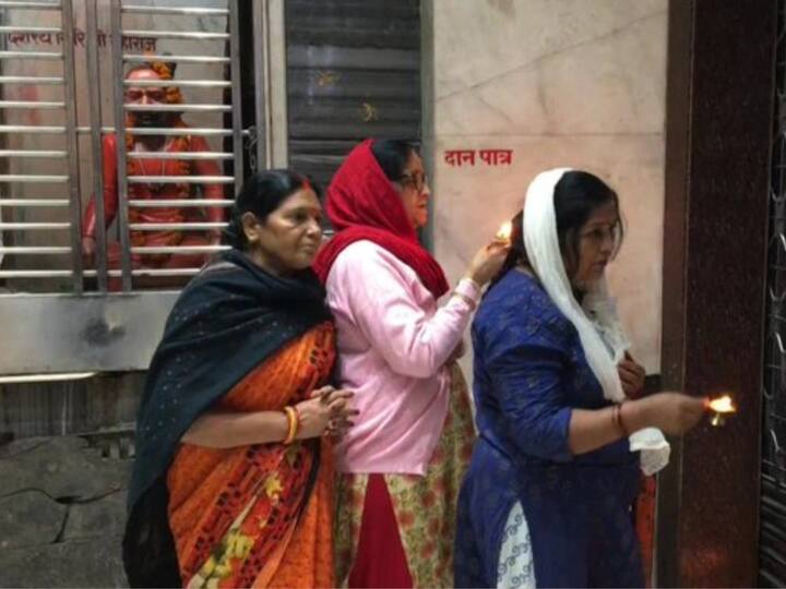 In another image, female devotees can be seen standing outside the temple doors as they offer their prayers to the lord. The doors of the temples will reopen for visitors after purification post the eclipse. (Image Source: Twitter | @ANINewsUP)