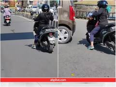 सड़क पर हैरतअंगेज अंदाज में स्कूटी चला रही महिला, यूजर्स बोले- पापा की परी