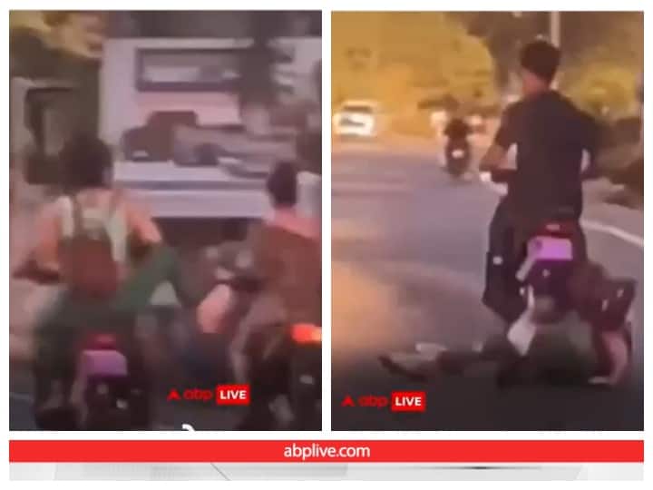 girl fell herself after kicking boy who riding bike users said instant karma Video: बाइकसवार को गिराने के चक्कर में खुद ही गिरी लड़की, यूजर्स बोले- Instant Karma