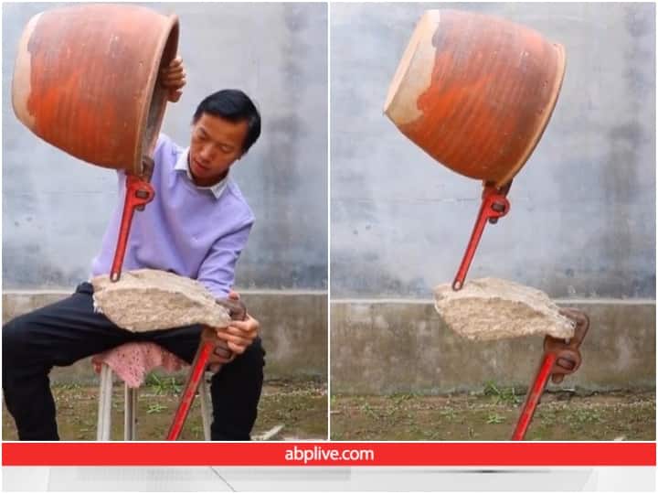 man is seen balancing a stone on an iron wrench in viral video Video: पत्थर पर शख्स ने टिकाया मिट्टी का गमला, यूजर्स बोले- आर्ट ऑफ बैलेंस