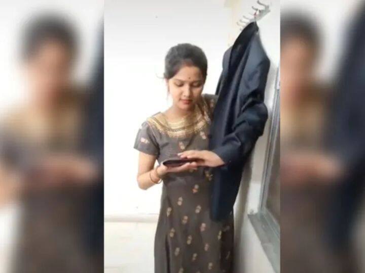 viral video trending marathi news woman thinking of taking out her purse from her husband coat Viral Video : नवऱ्याच्या पर्समधून पैसे काढण्याची पत्नीची 'निन्जा टेक्निक' व्हायरल! यूजर्सही आश्चर्यचकित