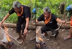 Shocking Video: ਜਿਉਂਦੇ ਸੱਪ ਨੂੰ ਅੱਗ 'ਤੇ ਪਕਾਉਂਦੇ ਹੋਏ ਨਜ਼ਰ ਆਈਆ ਵਿਅਕਤੀ, ਦਿਲ ਦਹਿਲਾ ਦੇਣ ਵਾਲੀ ਵੀਡੀਓ