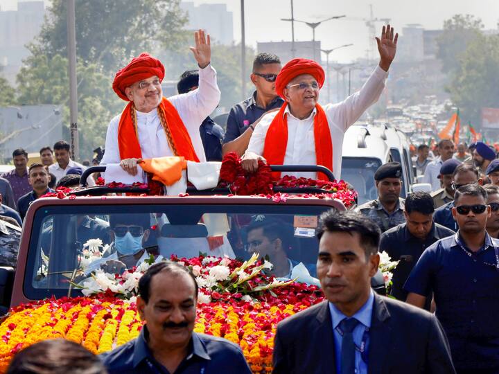 Union Home Minister Amit Shah with Bhupendra Patel in a roadshow to meet the voters of the state (Image Source: PTI)