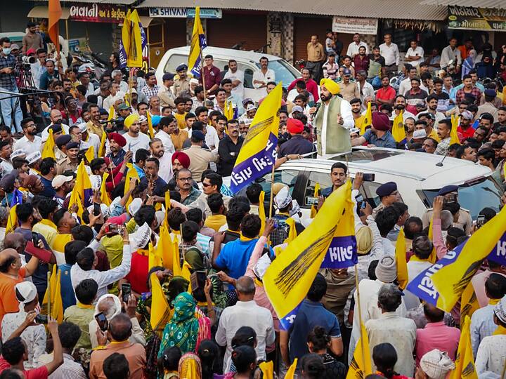 Punjab Chief Minister Bhagwant Mann speaks during a roadshow, ahead of Gujarat assembly elections, in Gir Somnath district (Image Source: PTI)