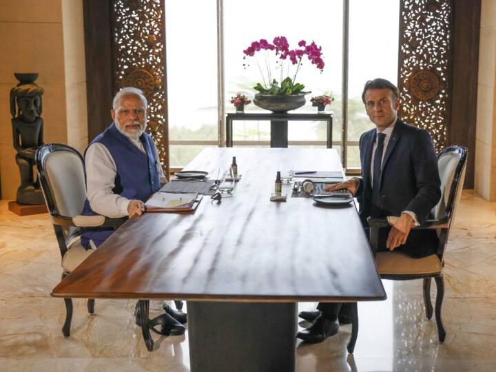 Prime Minister Narendra Modi and French President Emmanuel Macron hold a working lunch on the sideline of the G20 summit in Nusa Dua. (Source: AFP)