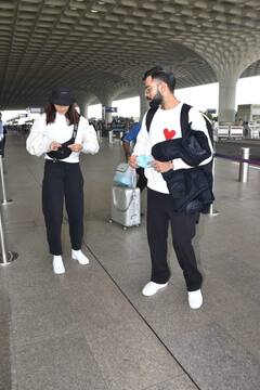 In Pics: विराट कोहली ने पहनी अनुष्का शर्मा के नाम की टी-शर्ट, ट्विनिंग में एयरपोर्ट पर स्पॉट हुए 'विरुष्का'