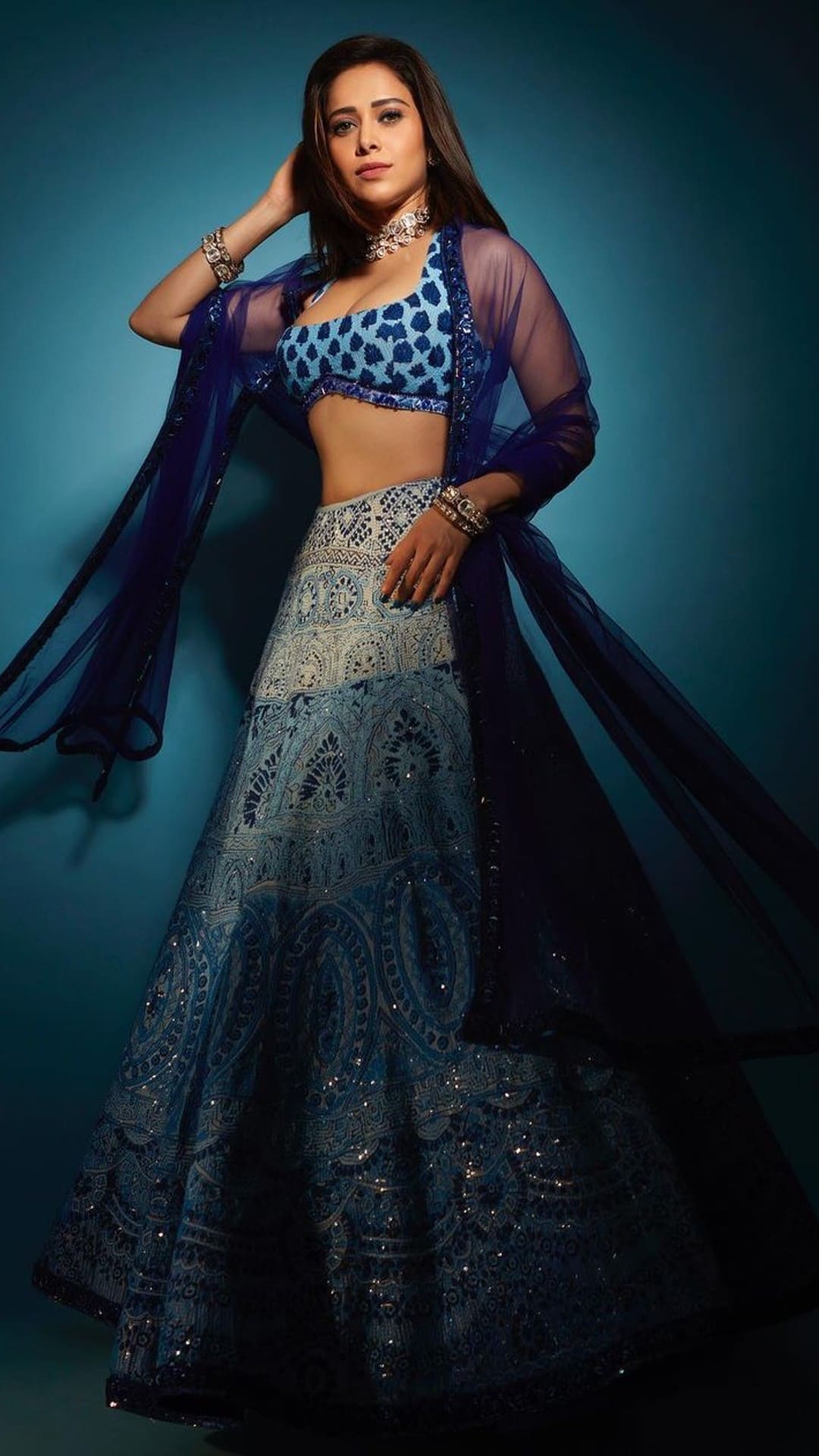 Manish Malhotra - The perfect hue to don in an intimate or grand nuptial  soiree. The voluminous lehenga paired with our #Noor bodice and scalloped  drape features heritage badla and delicate zari