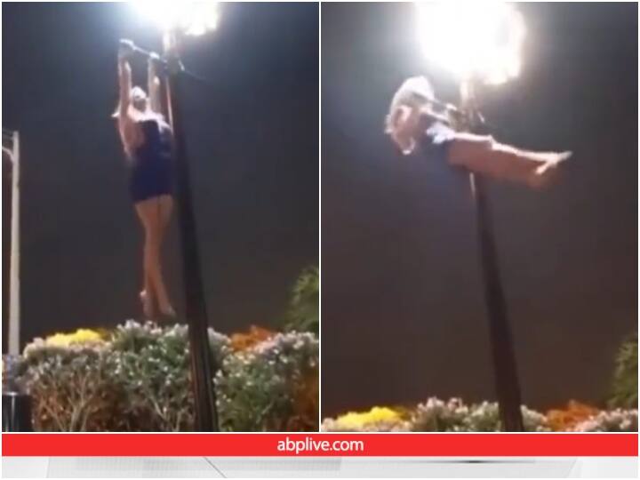 girl is seen doing pull-ups on an electric pole Video: ये होती है फिटनेस... देखिए किस तरह पोल पर चढ़कर लड़की ने लगा दिए पुल-अप्स