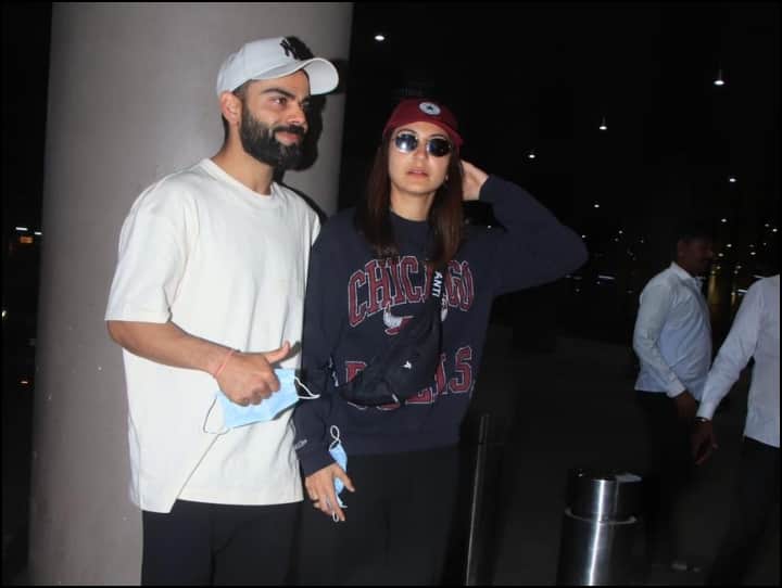 Virat Anushka Photos : बॉलीवुड अभिनेत्री अनुष्का शर्मा अपने पति और भारतीय क्रिकेटर विराट कोहली के साथ एयरपोर्ट पर स्पाट हुई हैं. हाल ही में ये दोनों छुट्टियां मनाने गए थे.