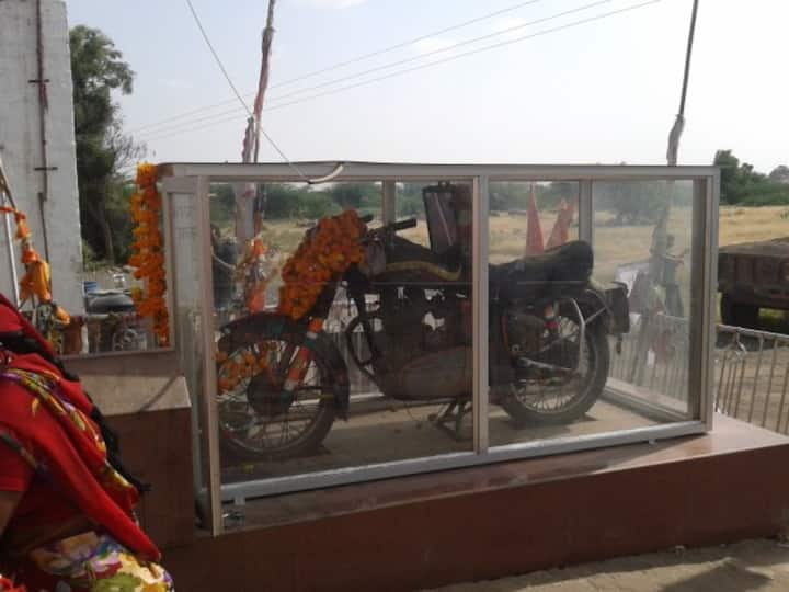 Bullet Baba Temple: According to legend, Om Singh Rathore, the son of the local leader, had an accident when his motorcycle crashed into a tree and he died as a result. The motorcycle was seized by the police, but the next day it was back in the same place! The cops locked the motorcycle and drained the gas tank, thinking it was a joke. They were shocked to discover it unchained and in the same location as the accident. The people erected a shrine for the bullet motorcycle and its owner after learning of this miracle. Motorcyclists and drivers who pass the shrine stop by and pay respect by either offering liquor or sprinkling it on the statue of Rathore. (Image Source: Twitter)