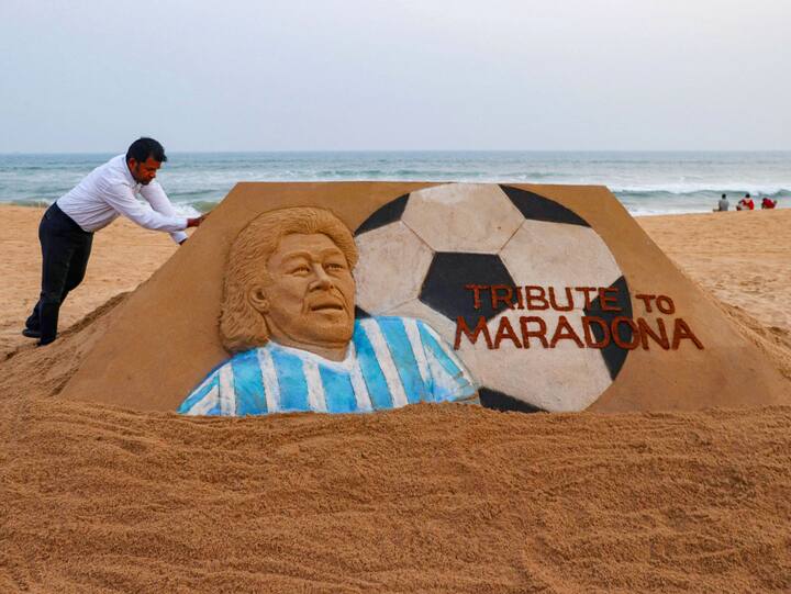 Artist Sudarsan Pattnaik creates a sand sculpture of footballer Maradona on his first death anniversary, in Puri, Thursday, Nov. 24, 2022. (Image Source: PTI)