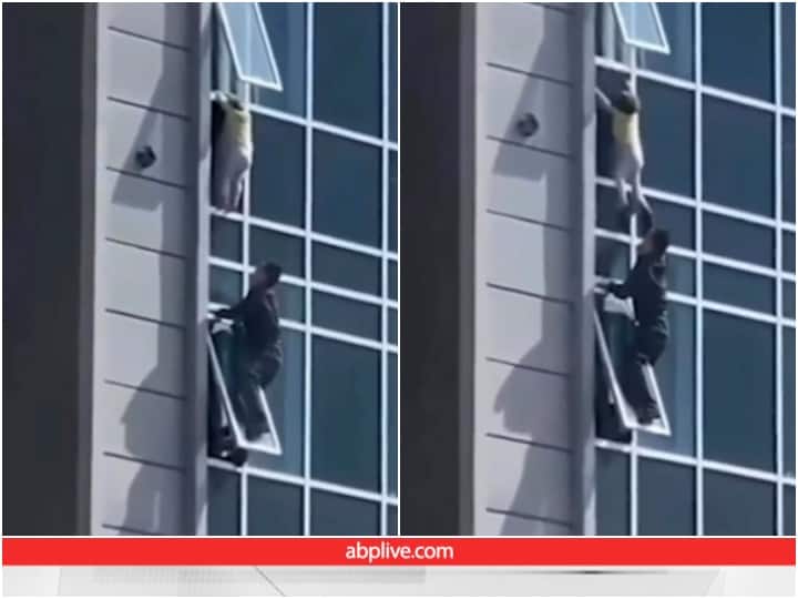 Man seen saving life of a child hanging from window of a high rise building Video: अपनी जान जोखिम में डाल कर शख्स ने बचाई बच्चे की जिंदगी, जीता लाखों दिल 