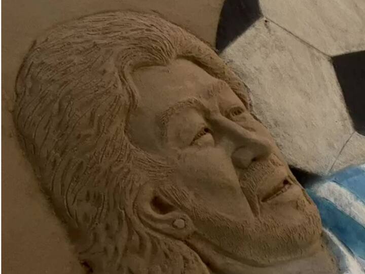 Artist Sudarsan Pattnaik creates a sand sculpture of footballer Maradona on his first death anniversary, in Puri. (Image Source: ANI)