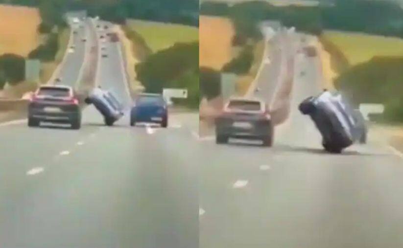 car stunt on highway amazed netizens shocking viral video on social media Viral Video: ਦੋ ਚੱਲਦੇ ਵਾਹਨਾਂ ਦੇ ਵਿਚਕਾਰ ਤੋਂ ਫਿਲਮੀ ਸਟਾਈਲ 'ਚ ਕੱਢੀ ਕਾਰ, ਵੀਡੀਓ ਦੇਖ ਉੱਡ ਜਾਣਗੇ ਹੋਸ਼
