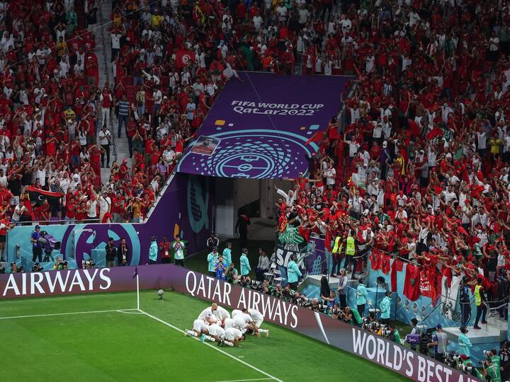 Morocco players celebrate in front of the crowd after winning the FIFA World Cup Qatar 2022 Group F match against Belgium at Al Thumama Stadium. (Image Source: Twitter/@FIFAWorldCup)