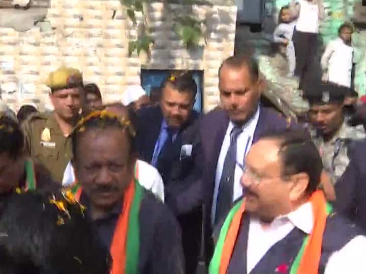 BJP chief J P Nadda along with Harsh Vardhan and other party leaders on a door-to-door campaign seeking votes for BJP in the upcoming MCD elections.