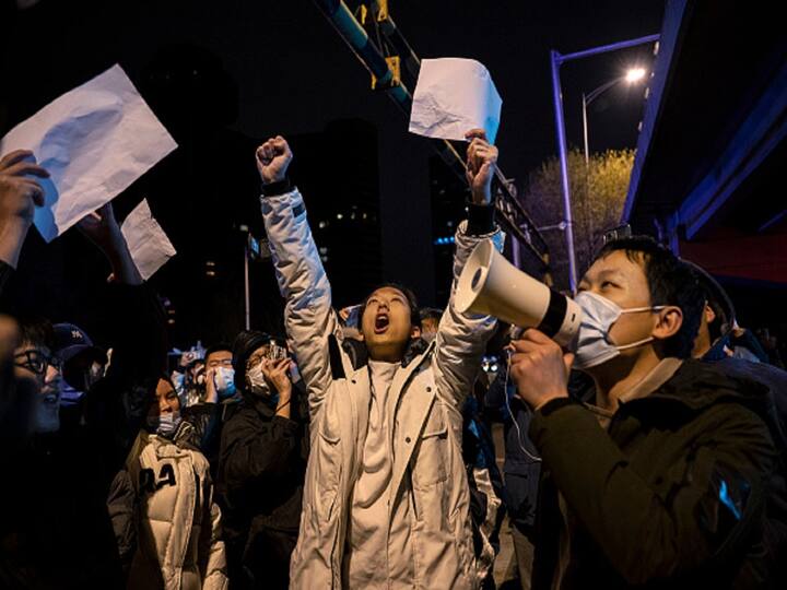 According to the Associated Press, police arrested two people at a protest location in Shanghai on Monday. Locals in Beijing continued to protest early Monday morning, in a rare display of public outrage directed at the government. The police were also seen separating people and asking them to remove images from their phones. (Image Source: Getty)