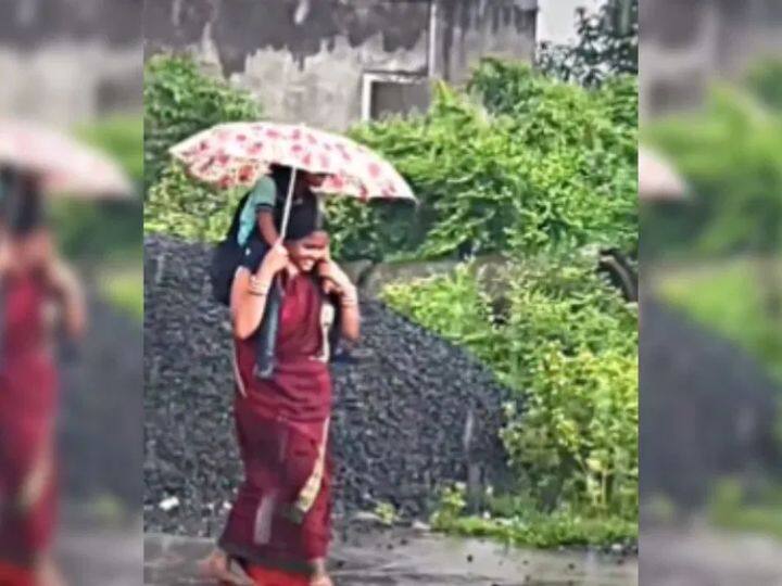 Viral Video marathi news mother carrying her daughter on shoulders during rain Viral Video : आईपेक्षा मोठा योद्धा नाही! 'हा' व्हिडीओ पाहिल्यानंतर नेटकरी झाले भावूक