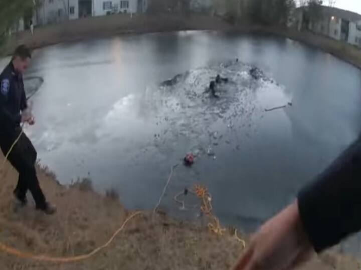 amazing VIDEO us aurira police risky rescue a boy and a woman from frozen pond Watch: बर्फीले तालाब में फंस गए थे एक बच्चा और महिला, पुलिस ने ऐसे निकाला-देखें हैरतअंगेज वीडियो