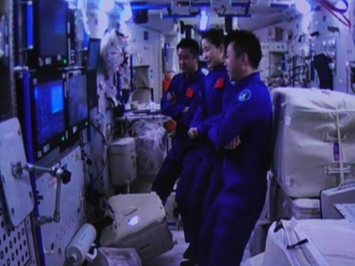 This image shows the crew of China's Shenzhou-14 manned spaceship observing the Shenzhou-15 spaceship conducting a fast automated rendezvous and docking with the space station's Tianhe module on Nov. 30. (Xinhua/Guo Zhongzheng)