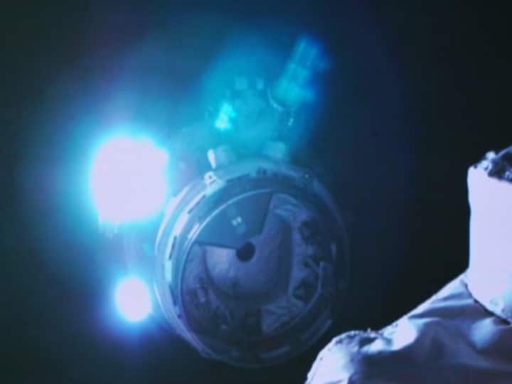 The spaceship is seen conducting a fast automated rendezvous and docking with the space station's Tianhe module on Nov. 30. (Xinhua/Guo Zhongzheng)