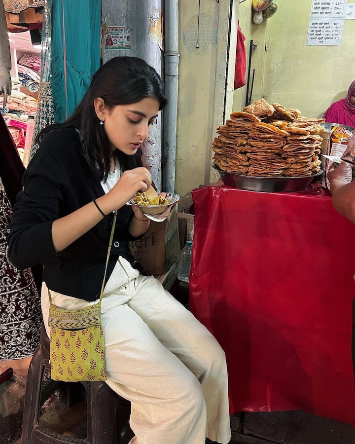 Navya looks like a wanderlust as she enjoys herself savouring street food like a commoner.