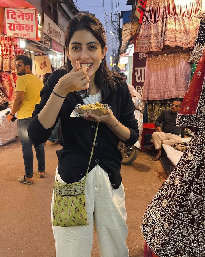 She looks all cheerful as she gets clicked in the marketplace of Bhopal.