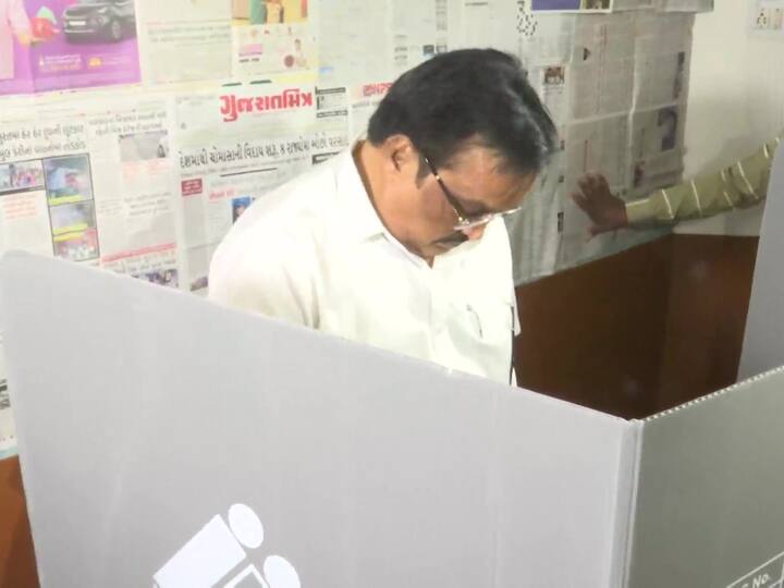 Gujarat BJP chief CR Paatil captured casting his vote in Surat. 