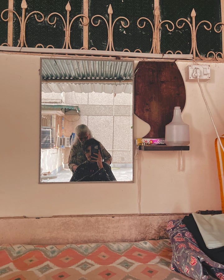 One of the pictures also shows her getting a haircut from her nani. (All image: Navya Nanda/Instagram).