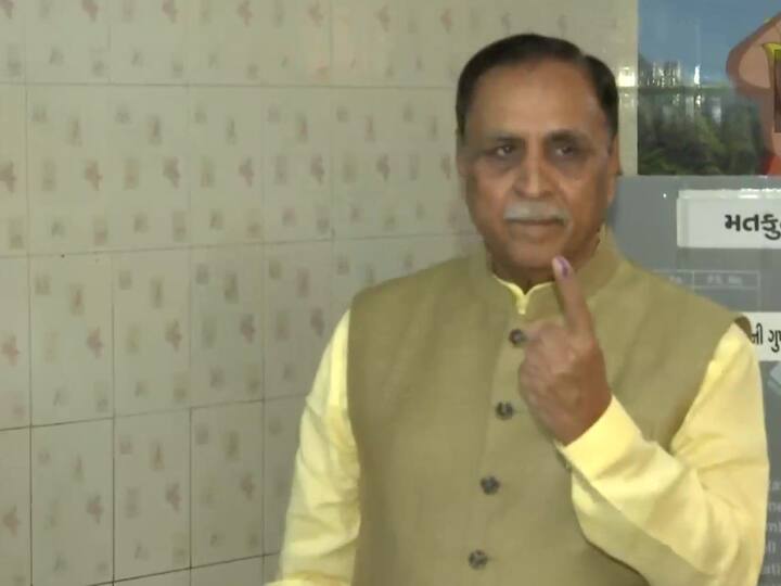 Former Gujarat CM Vijay Rupani cast his vote in Rajkot with his wife Anjali Rupani. (Source: ANI)