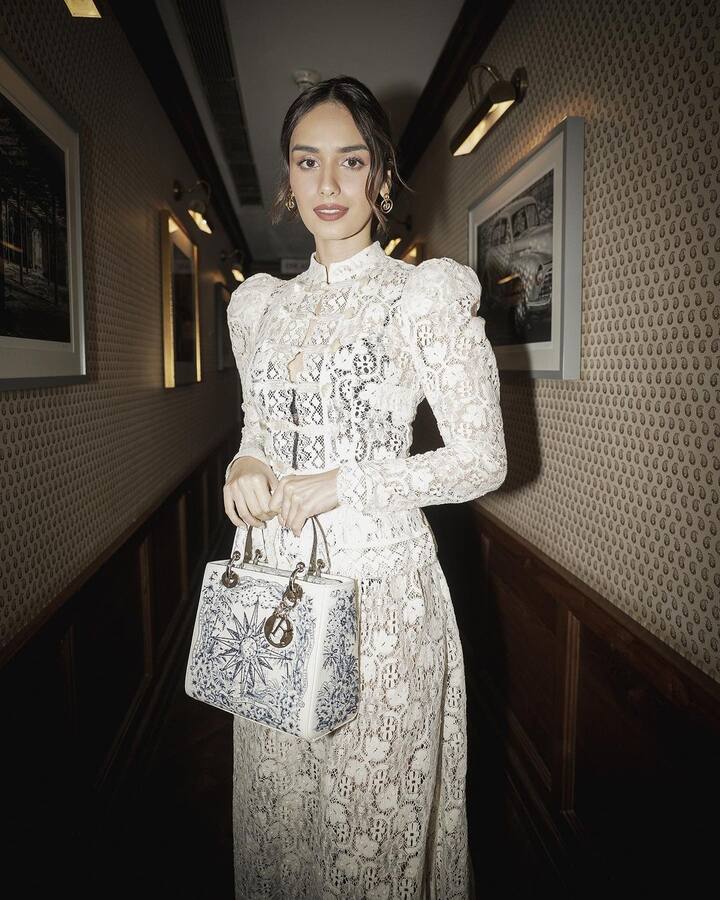 The actor wore subtle makeup, including nude eyeshadow, black eyeliner, contoured cheeks, a nude lipstick shade. She styled her hair in a bun with a few strands on her face. (Images Source: Instagram/manushi_chhillar)