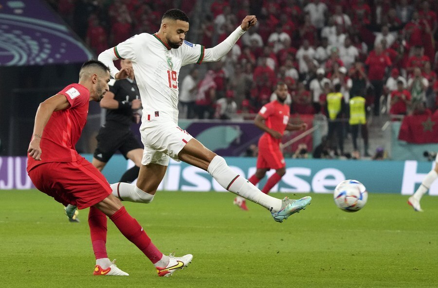 Youssef En-Nesyri (R) of Morocco shoots during the Group F match against Canada at the 2022 FIFA World Cup at Al Thumama Stadium in Doha, Qatar, Dec. 1, 2022.