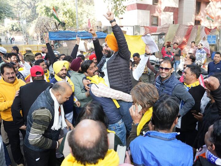 The initial trends showed BJP ahead but as the pendulum swung in AAP's favour, celebrations picked up with supporters carrying party flags distributing sweets and dancing to the beat of drums. (Source: PTI)