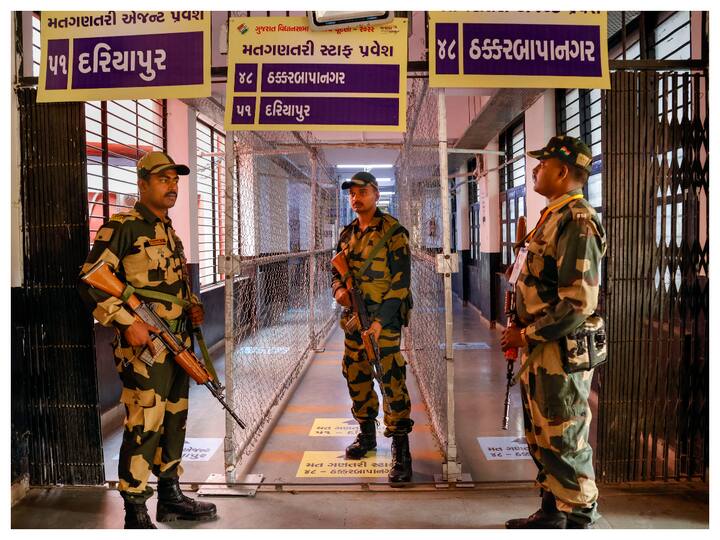 While the contest in Gujarat has always been between the BJP and Congress, it has been three-cornered this time with Aam Aadmi Party (AAP) entering the poll arena. The image shows Border Security force (BSF) personnel standing guard at a strongroom in Ahmedabad ahead of vote counting. (Image: PTI)