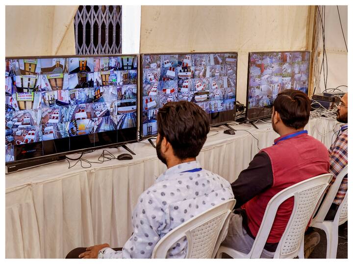 The counting of votes will start at 8 am at 37 counting centres covering the 182 Assembly seats. The image shows polling officials monitoring a strongroom through CCTV footage ahead of counting of votes. (Image: PTI)