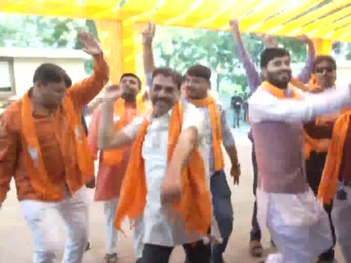 BJP workers are filled with joy as they dance their hearts away after the party crosses majority mark as per ECI early trends, in Gandhinagr, Gujarat. (Source: ANI)